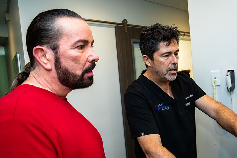 Doctor and patient discussing information about the patients dental implant procedure