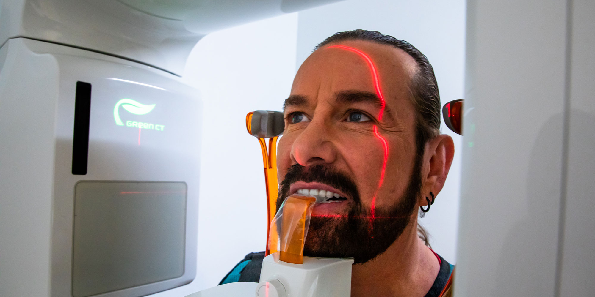 Patient within practice having a 3D scanning with the dental practices technology equipment